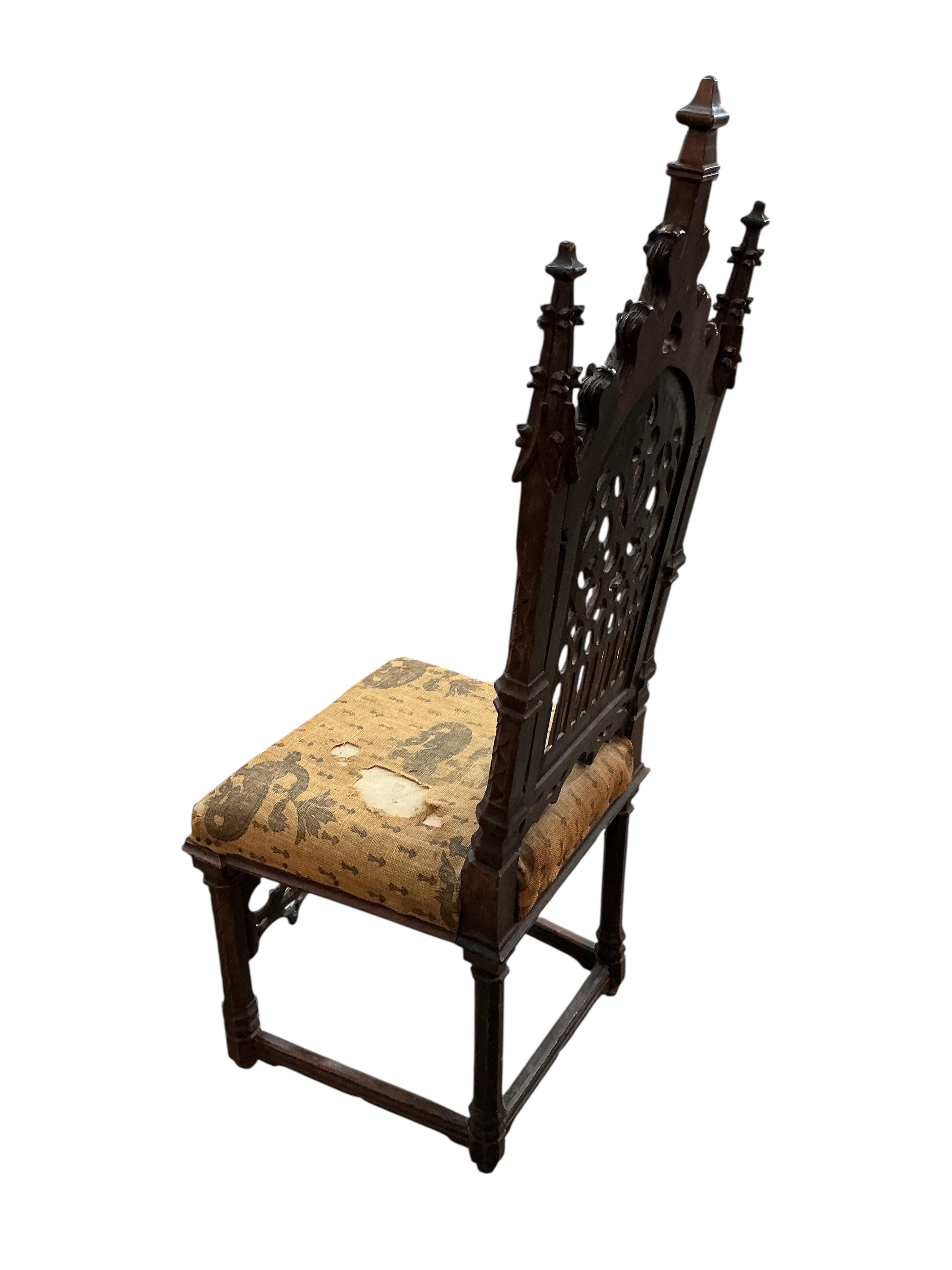 Attributed to Ferdinand Rothbart, a Victorian carved walnut Gothic Revival side chair, width 38cm, depth 41cm, height 113cm